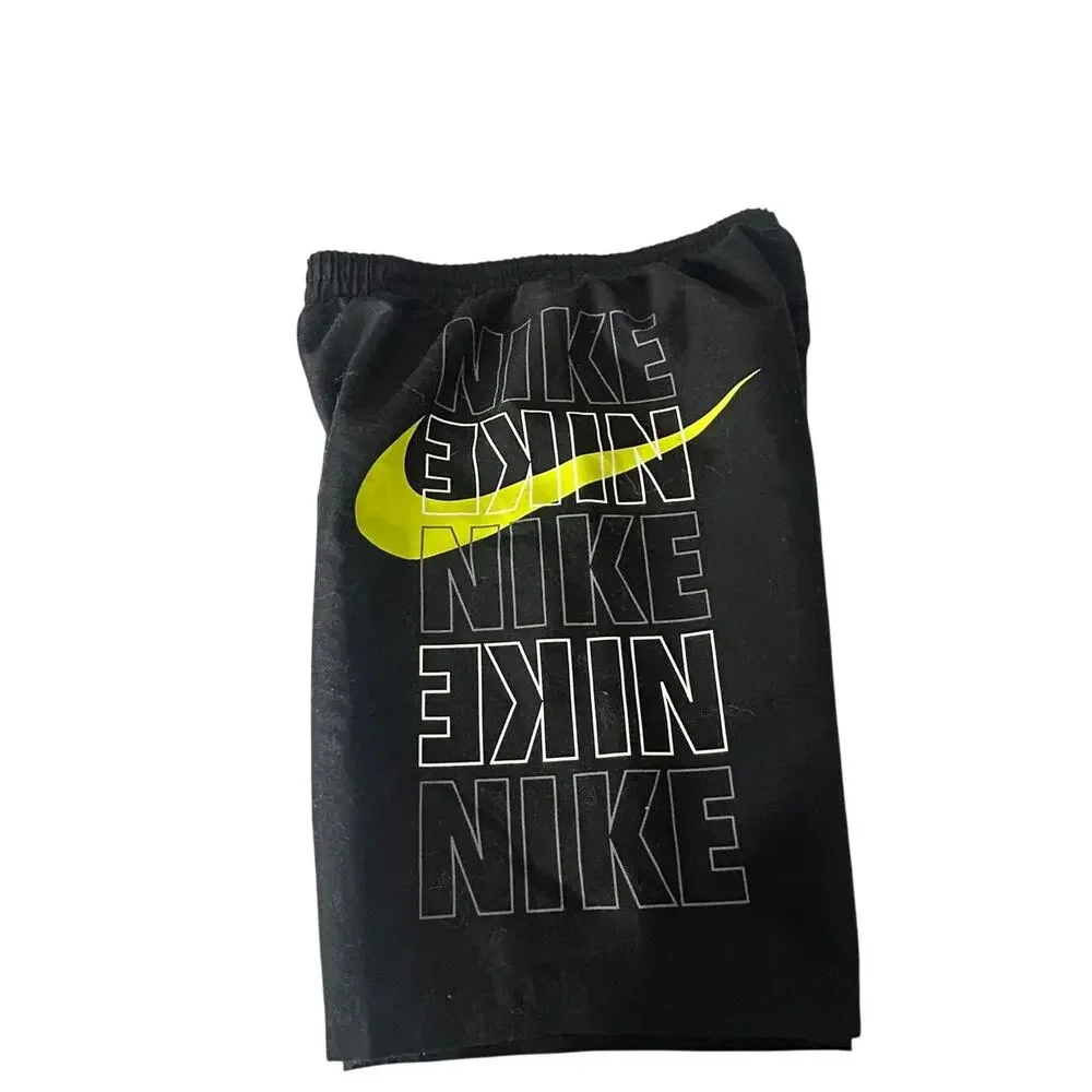 Nike boys size small Volley shorts black with bright green swoosh